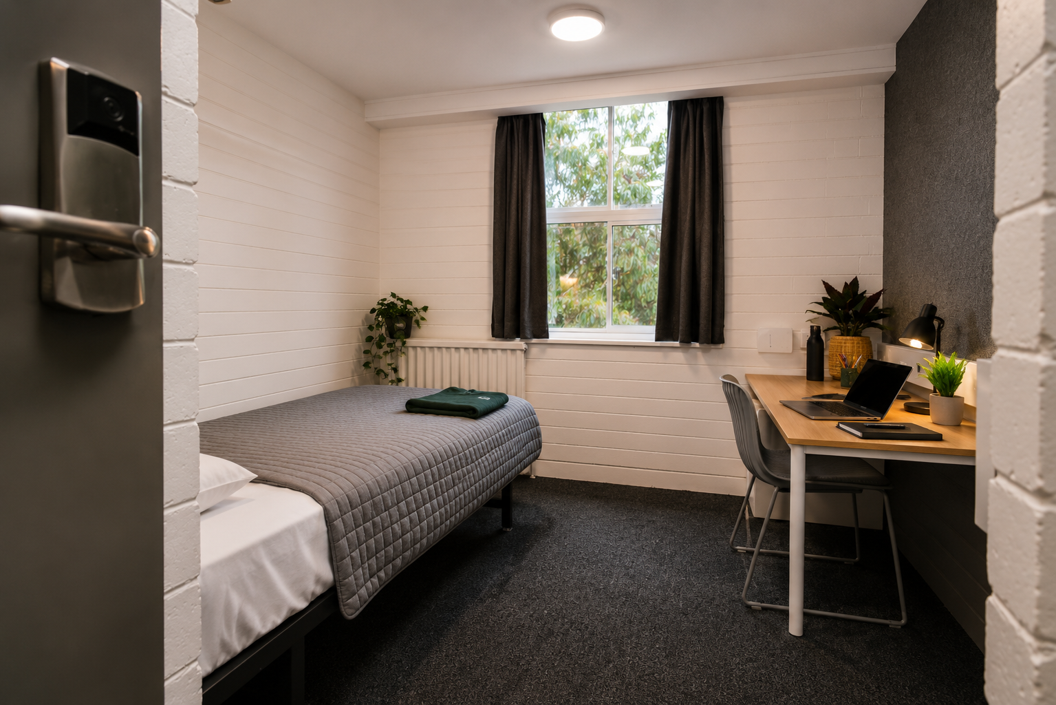 Refurbished standard student bedroom featuring a single bed, study desk, built-in wardrobe, sink, heater and high-speed Wi-Fi.