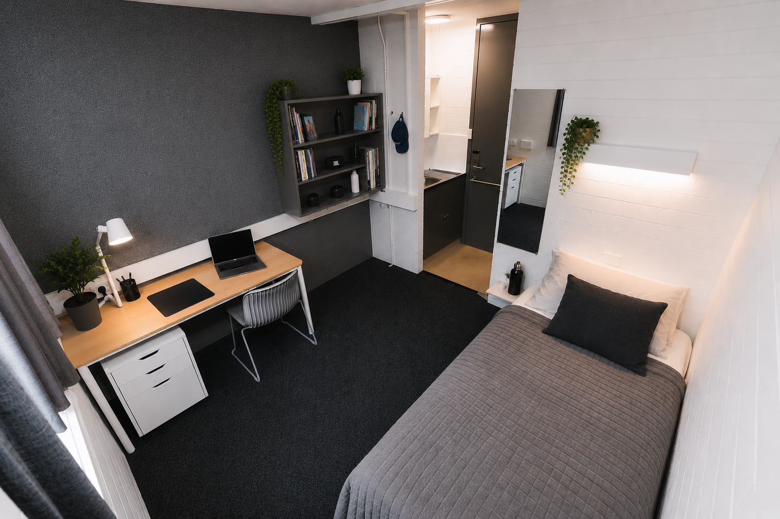 Refurbished standard student bedroom featuring a single bed, study desk, built-in wardrobe, sink, heater and high-speed Wi-Fi.